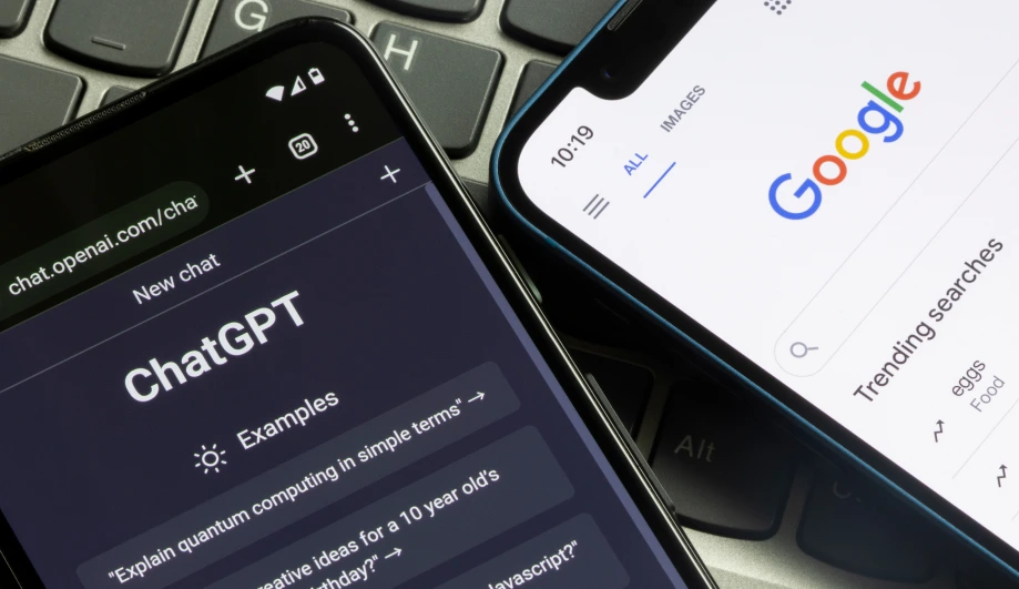 A smartphone displaying ChatGPT and Google search apps side by side, representing AI-powered search and digital technology.