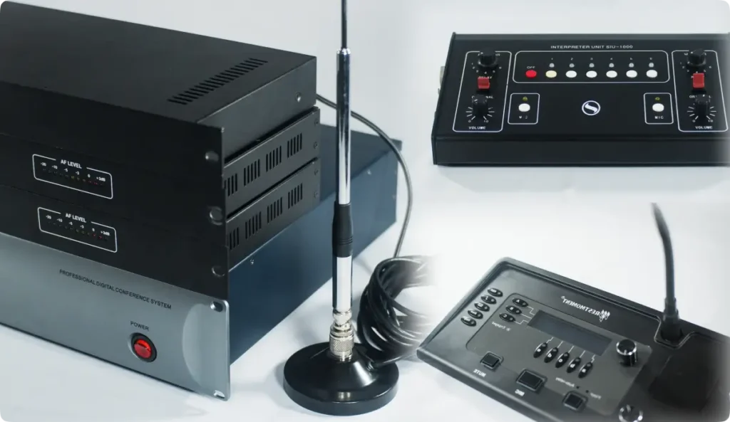 Complete professional interpretation equipment setup including digital conference system, interpreter units, and wireless transmitter